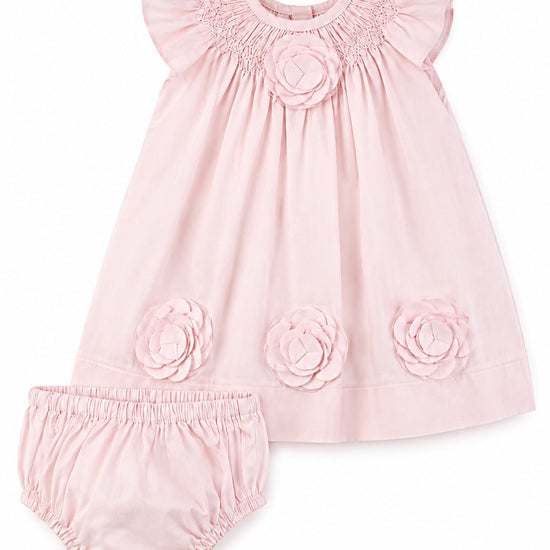 Carriage Boutique classic pink baby girl dress with smocked bodice and 3D cut-out flower details, includes bloomers.
