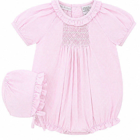 Carriage Boutique pink gingham cotton baby girl bubble romper with hand-embroidered smocking and matching bonnet hat.