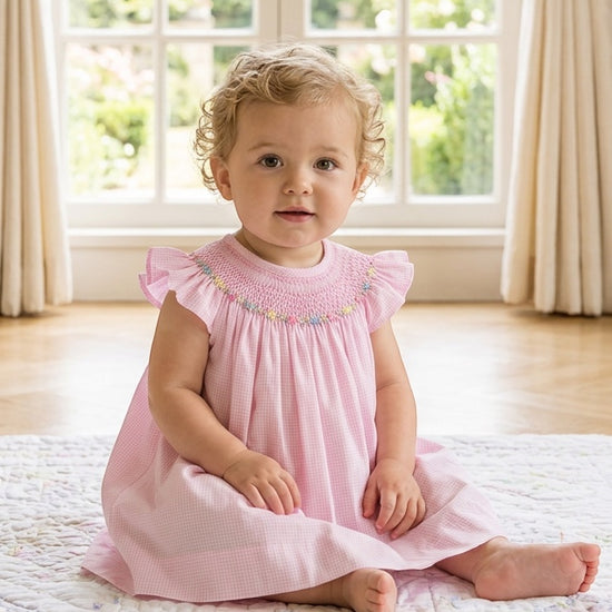 Carriage Boutique pink gingham baby girl bishop dress with flutter sleeves and hand-embroidered floral smocking