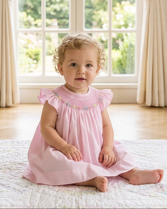Carriage Boutique pink gingham baby girl bishop dress with flutter sleeves and hand-embroidered floral smocking