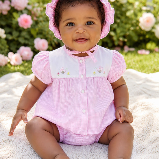 Carriage Boutique baby girl pink gingham bubble romper with hand-embroidered carriage design and matching ruffled hat.