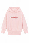 Carriage Boutique baby girl pink knit hoodie with Madison embroidered in red on the chest and ribbed trim
