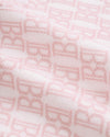 Carriage Boutique soft pink cotton baby blanket with a classic knit monogram B pattern for a cozy nursery.