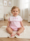 Carriage Boutique baby girl bubble romper in pink with white Peter Pan collar and custom monogram embroidery.