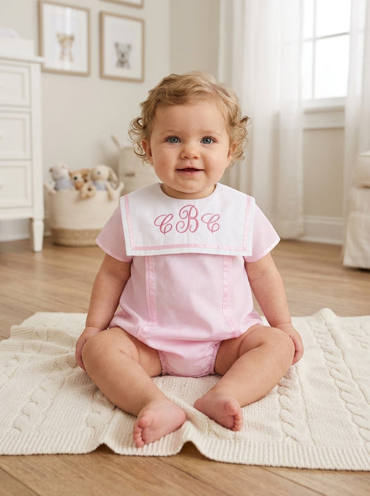 Carriage Boutique baby girl bubble romper in pink with white Peter Pan collar and custom monogram embroidery.