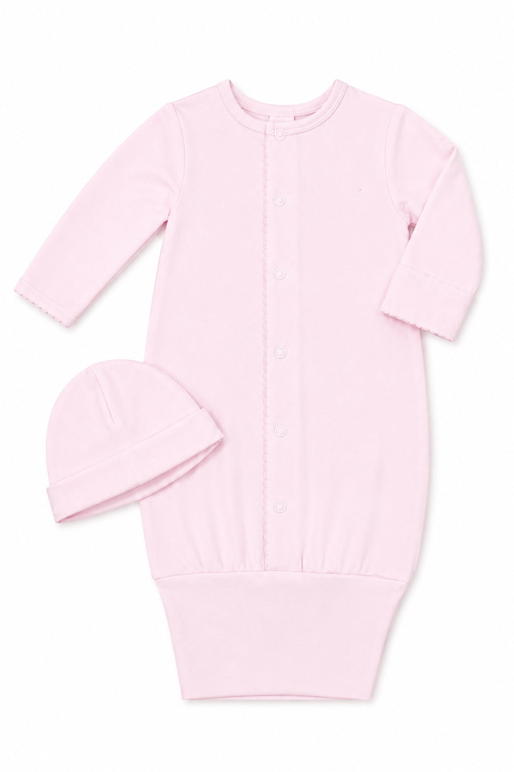 Carriage Boutique pink newborn sleep sack with matching hat, long sleeves, and scalloped trim on a white background.