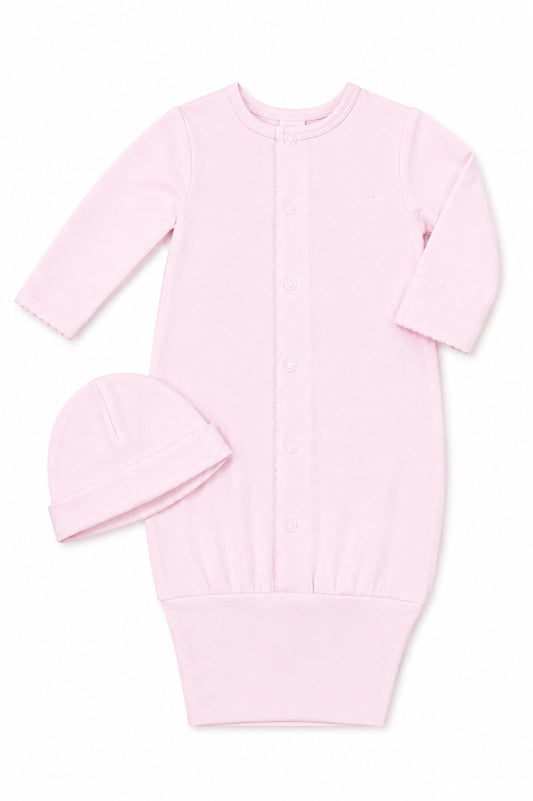 Carriage Boutique pink newborn sleep sack with matching hat, long sleeves, and scalloped trim on a white background.