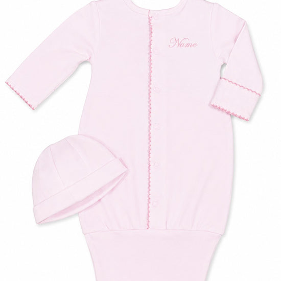 Carriage Boutique pink newborn sleep sack with matching hat, featuring scalloped trim and customizable monogram area.