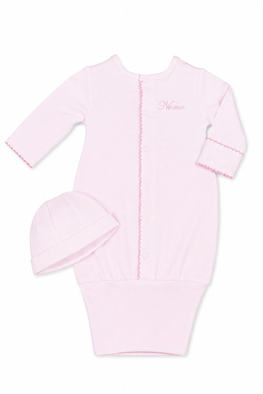 Carriage Boutique pink newborn sleep sack with matching hat, featuring scalloped trim and customizable monogram area.
