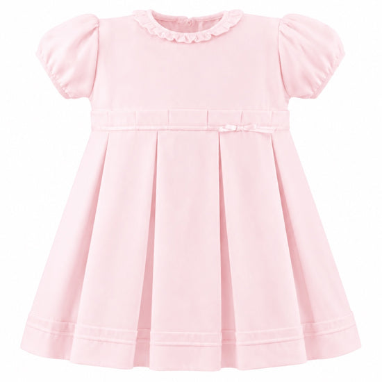 Carriage Boutique pink pique baby girl dress with a ruffled collar, puff sleeves, and a pleated skirt.