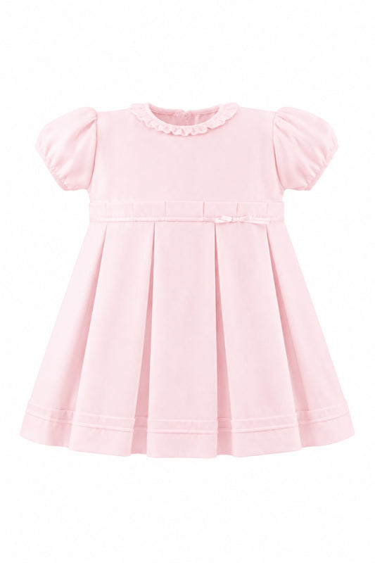 Carriage Boutique pink pique baby girl dress with a ruffled collar, puff sleeves, and a pleated skirt.