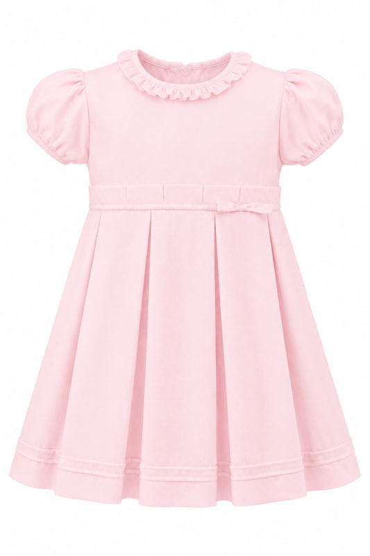 Carriage Boutique pink pique toddler girl dress with a ruffled collar, puff sleeves, and a pleated skirt.