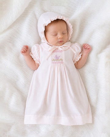 Carriage Boutique pale pink baby dress and bonnet set with hand-smocked bodice and embroidered bird motif