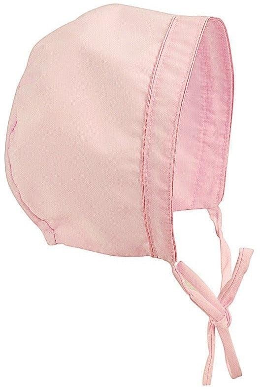 Carriage Boutique pink hand-smocked bishop dress bonnet with pearl cross detail and ties. 100% cotton.