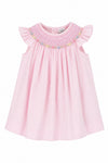 Carriage Boutique pink baby girl bishop dress with flutter sleeves and hand-embroidered floral smocking details.
