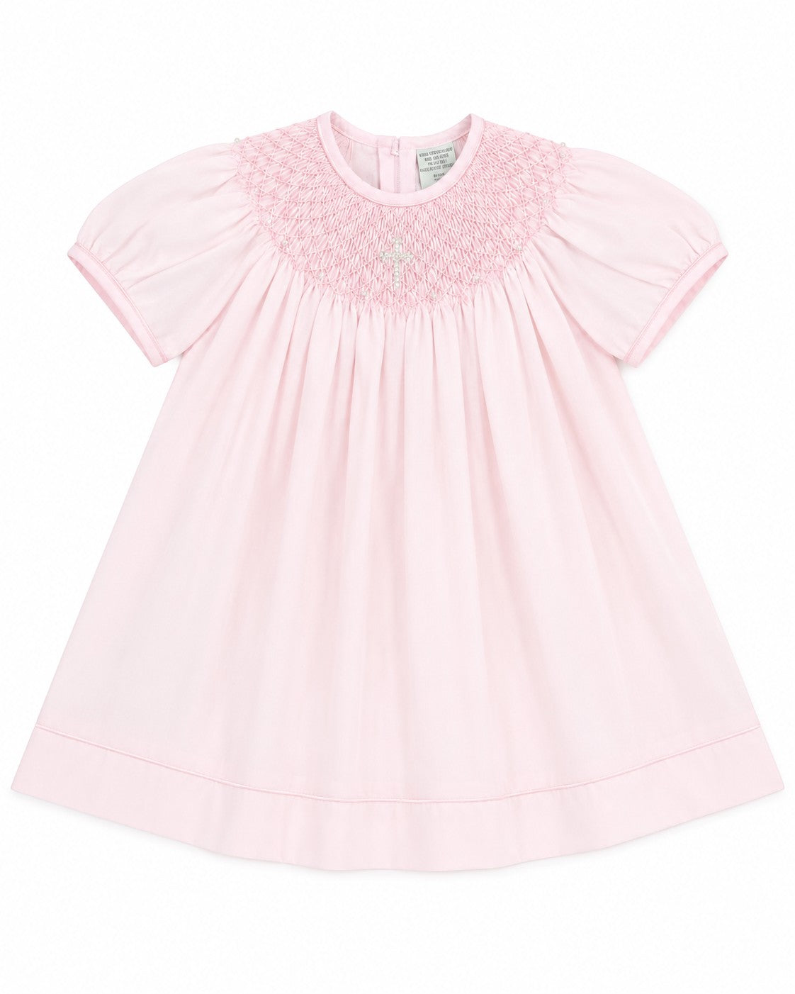 Carriage Boutique baby girl pink cotton bishop dress with hand-smocked pearl cross detail and matching bonnet.