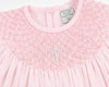 Carriage Boutique pink cotton baby christening bishop dress with hand-smocked detail and pearl cross embellishment.