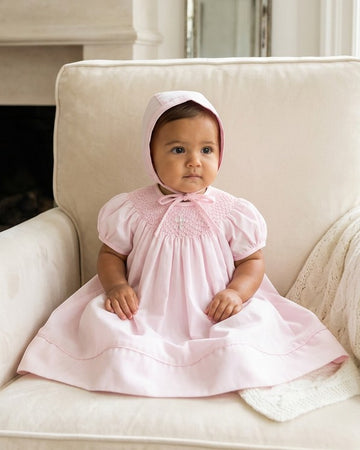 pink dress christening Joli Gown at Baby Beau & Belle smocked detailing and adorned with pearl crosses Christening dress with short, RAW