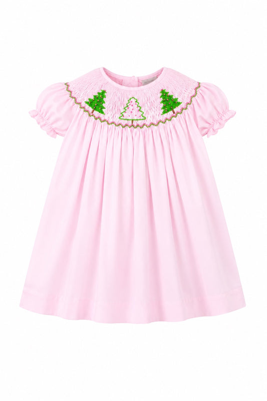Carriage Boutique toddler girl pink cotton bishop dress with hand-smocked green and white Christmas tree embroidery.