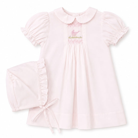 Carriage Boutique pale pink smocked heirloom dress with bird embroidery, Peter Pan collar, and matching ruffled bonnet.
