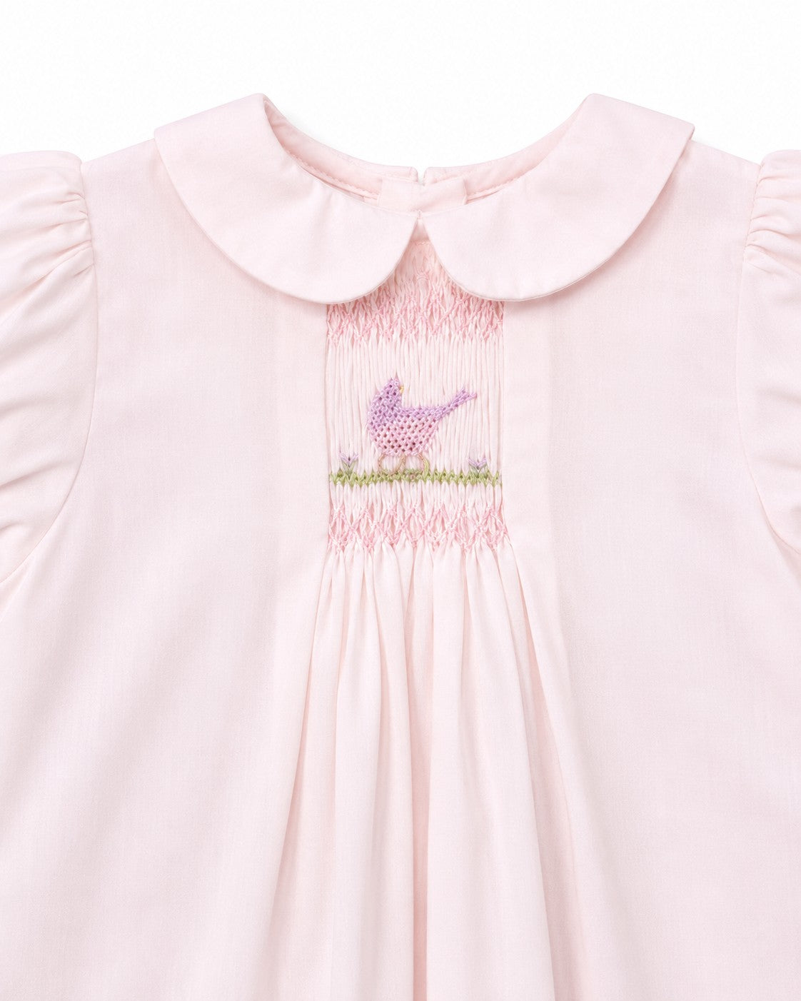 Carriage Boutique pale pink baby dress with hand-smocked bodice, bird embroidery, and Peter Pan collar.