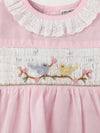 Carriage Boutique baby girl dress with pink fabric, white eyelet collar, and hand-smocked bird and flower embroidery.