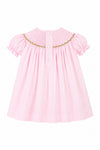 Carriage Boutique pink cotton toddler dress with smocked bishop neckline and back button closure