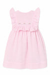 Carriage Boutique pink Swiss dot baby girl dress with ruffled sleeves and delicate floral embroidery on the bodice.