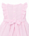 Carriage Boutique baby girl pink Swiss dot dress with ruffled sleeves, back button closure, and a decorative waist bow