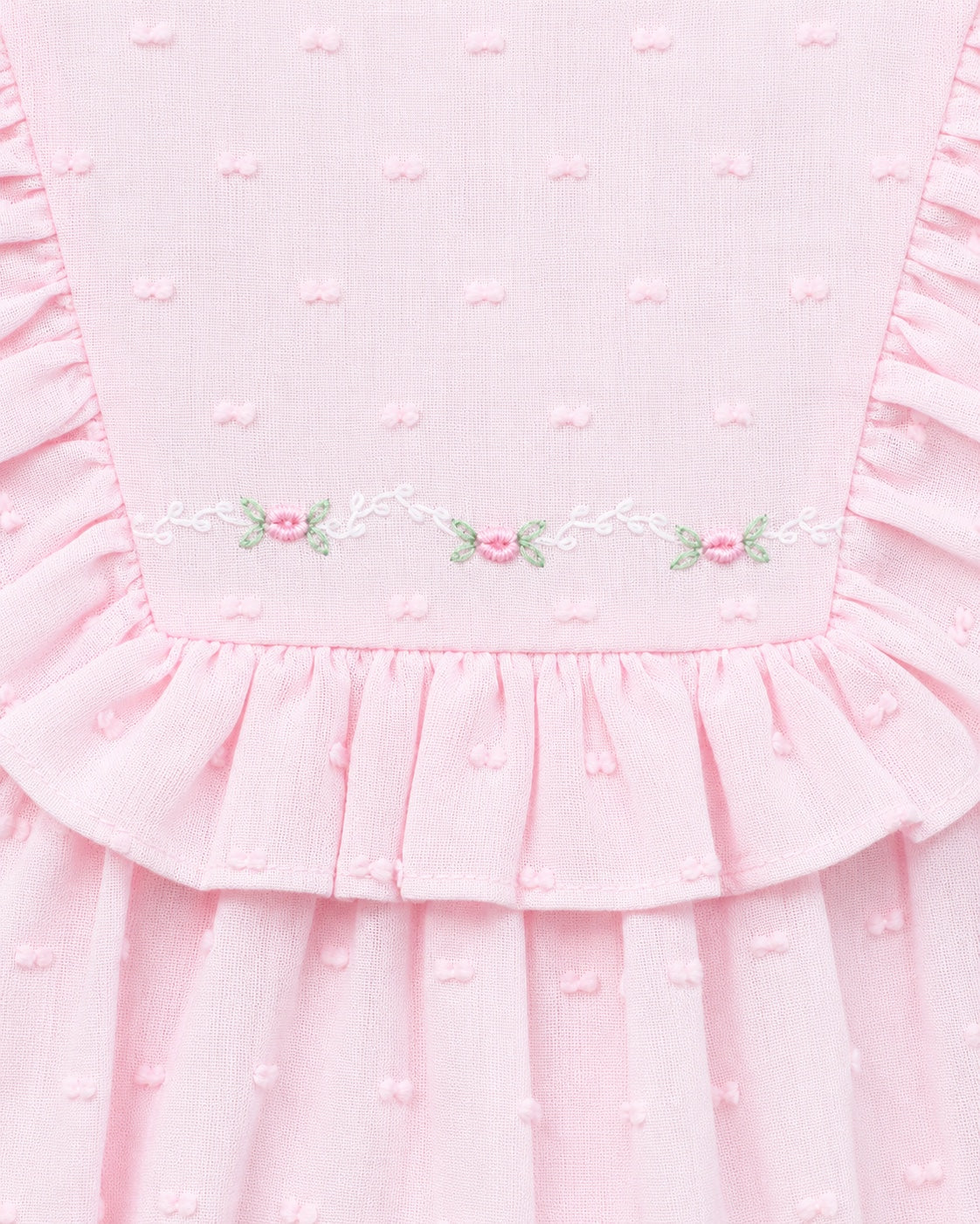 Carriage Boutique pink baby bubble romper with Swiss dot texture, ruffled yoke, and delicate floral embroidery.