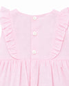 Carriage Boutique baby girl bubble romper in soft pink with Swiss dot texture, ruffled shoulders, and button back.