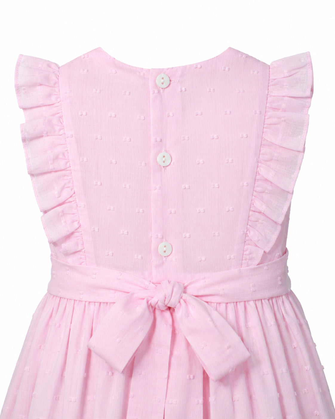 Carriage Boutique pink toddler dress with Swiss dot texture, ruffled sleeves, button back, and a tied waist sash.
