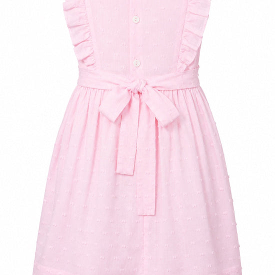 Carriage Boutique pink toddler dress with Swiss dot texture, ruffled sleeves, and a back tie waist.