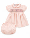 Carriage Boutique pink taffeta baby girl dress with hand-smocked floral waist, puffed sleeves, and matching bloomers.