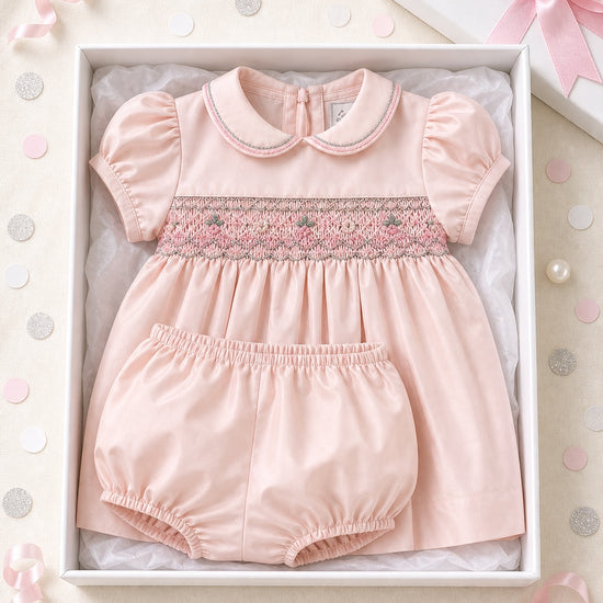 Carriage Boutique pink taffeta baby girl dress with hand-smocked floral waist and matching bloomers in a gift box.