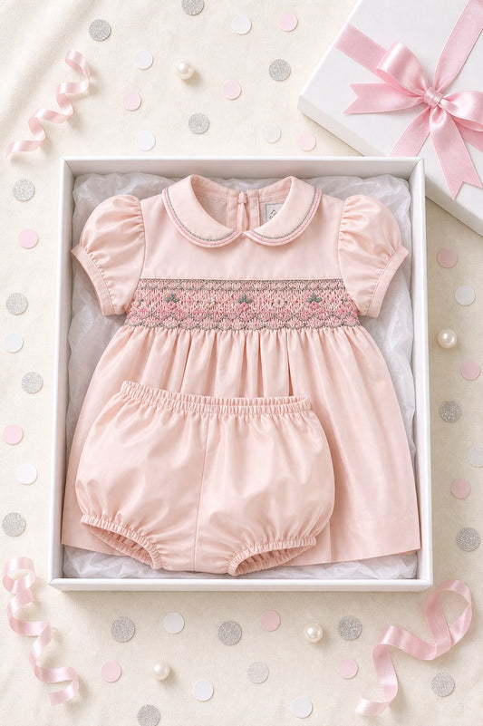 Carriage Boutique pink taffeta baby girl dress with hand-smocked floral waist and matching bloomers in a gift box.