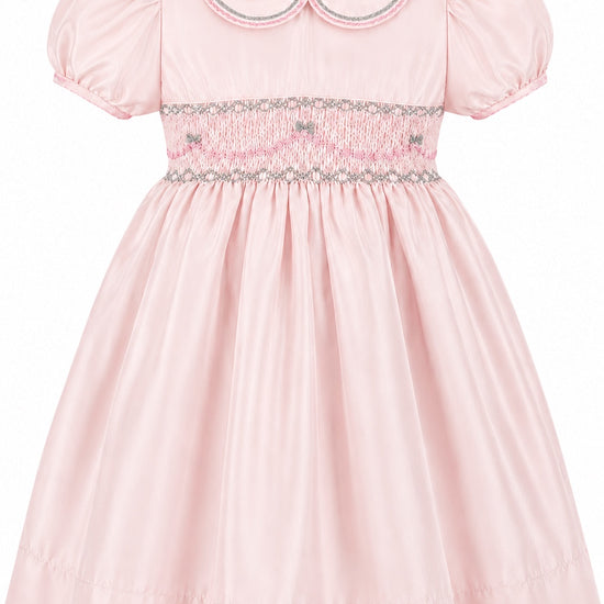 Carriage Boutique pink taffeta toddler girl dress with hand smocked bodice, peter pan collar, and puff sleeves.