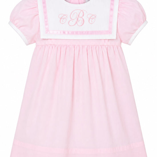 Carriage Boutique pink and white short sleeve toddler dress with a sailor-style collar and embroidered monogram