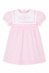 Carriage Boutique pink and white short sleeve toddler dress with a sailor-style collar and embroidered monogram