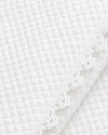 Carriage Boutique off-white quilted baby christening blanket featuring delicate floral lace trim detail