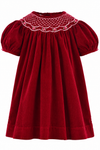 Carriage Boutique red corduroy bishop dress for toddlers with hand-smocked collar and floral embroidery details.