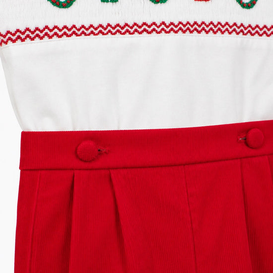 Carriage Boutique red corduroy bobby suit with white top featuring hand-smocked Christmas wreaths and gift motifs