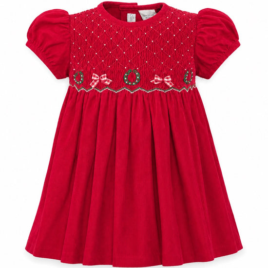 Carriage Boutique red corduroy baby girl dress with smocked bodice, Christmas wreath embroidery, and short sleeves.