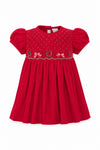 Carriage Boutique red corduroy baby girl dress with smocked bodice, Christmas wreath embroidery, and short sleeves.