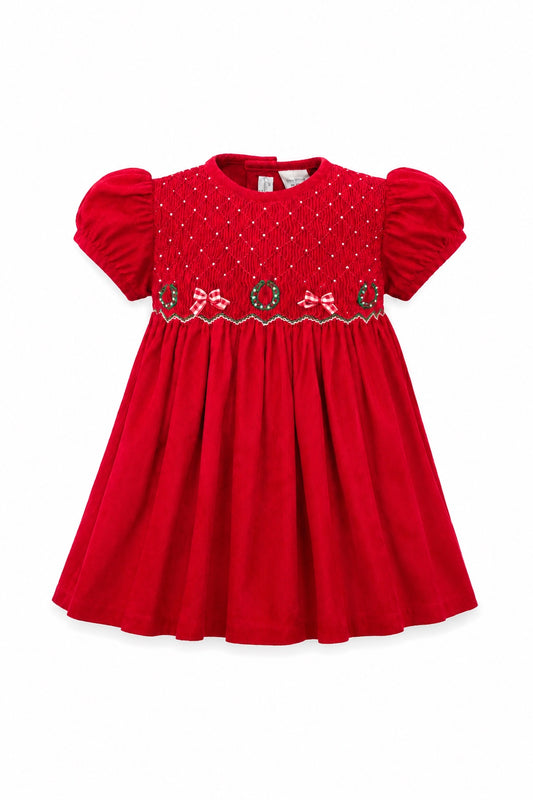 Carriage Boutique red corduroy toddler dress with smocked diamond pattern, Christmas wreaths, and bows.