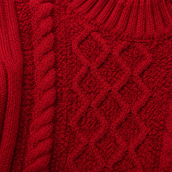 Carriage Boutique red fisherman knit pullover sweater with textured cable patterns and wooden button details.