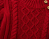 Carriage Boutique red fisherman knit pullover sweater with textured cable patterns and wooden button details.