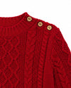 Carriage Boutique red fisherman knit pullover sweater with wooden shoulder buttons and textured cable knit pattern.