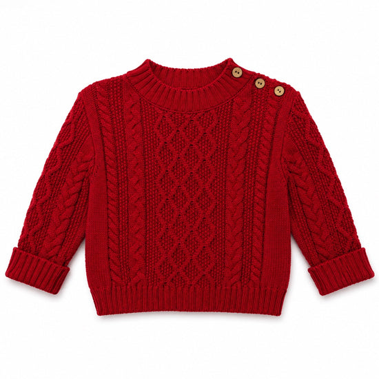Carriage Boutique red fisherman knit pullover sweater with shoulder button details and textured cable knit pattern.