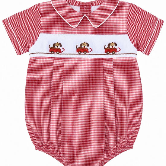 Carriage Boutique red gingham baby bubble romper with smocked bodice featuring dogs in cars, Peter Pan collar, and white piping.